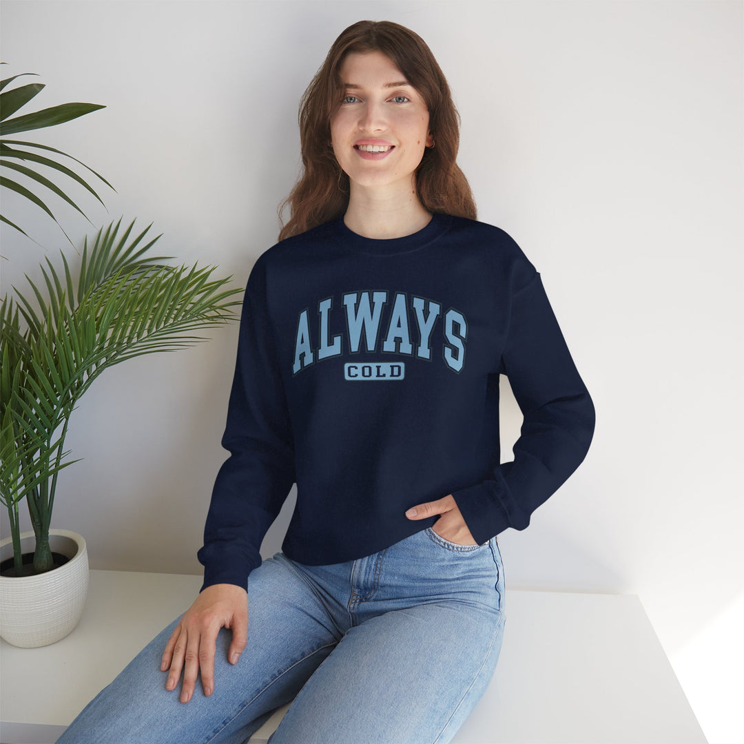 Always Cold Varsity Graphic Sweatshirt by Printify featuring bold lettering and a cozy, casual design.