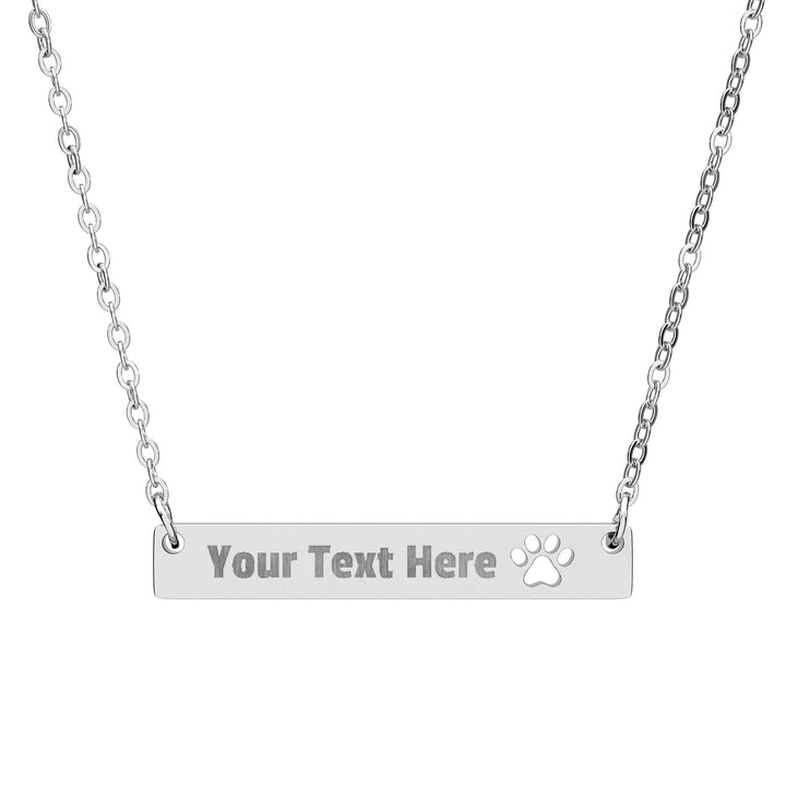 Engraved paw print cutout bar necklace from Printify, featuring a sleek silver pendant with paw print engraving on a chain.