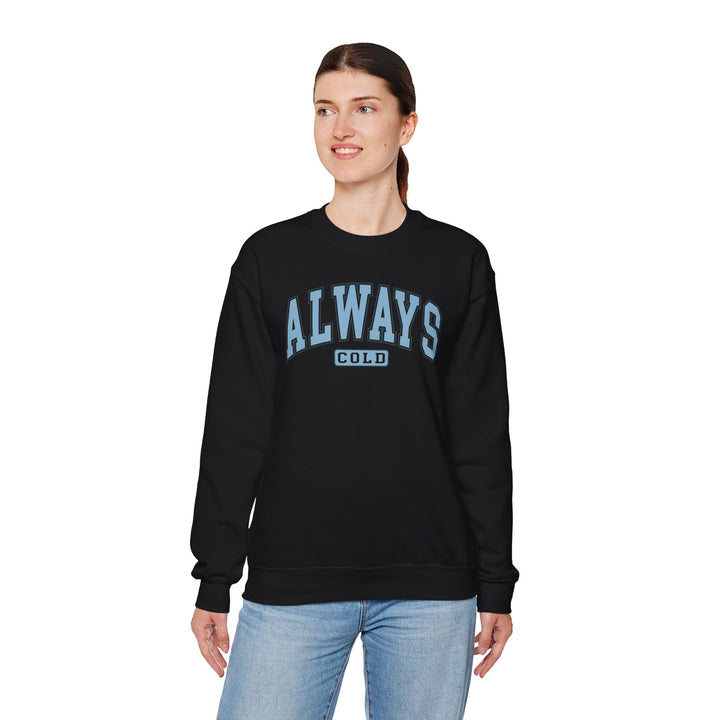 Always Cold Varsity Graphic Sweatshirt by Printify, featuring a bold graphic design on a cozy fabric.