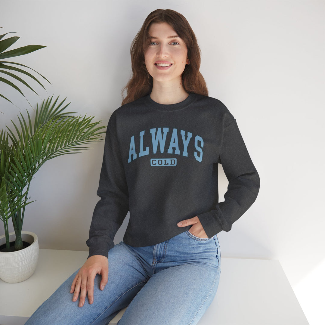 Always Cold Varsity Graphic Sweatshirt by Printify, featuring a bold graphic and classic varsity style in a cozy fit.