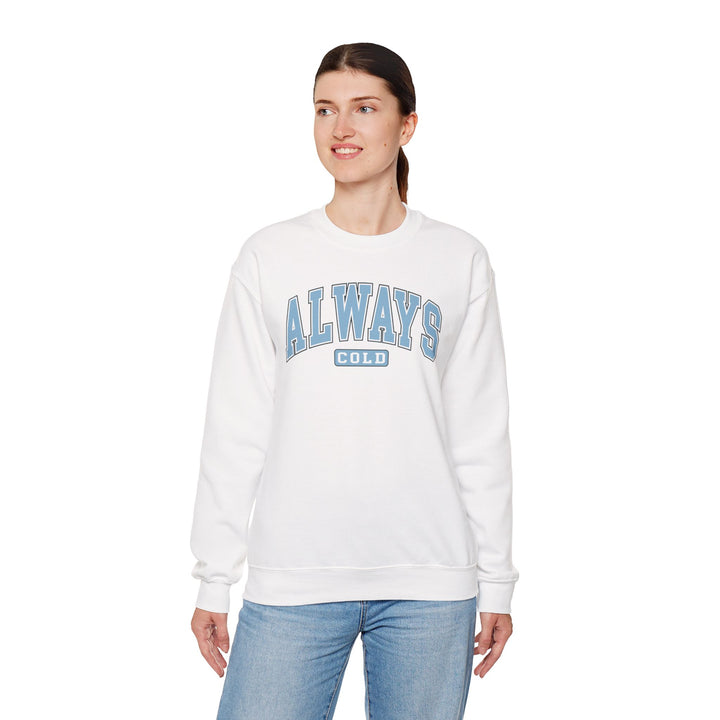 Always Cold Varsity Graphic Sweatshirt by Printify featuring a bold graphic design and a cozy, relaxed fit.